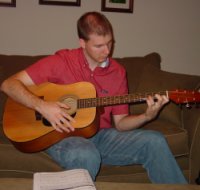 Playing DJ playing his new guitar